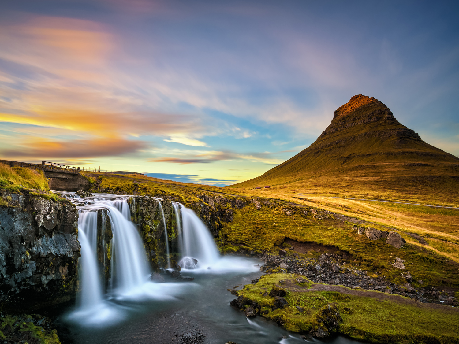 Brilliant green and purple Northern Lights (Aurora Borealis) over a snowy landscape